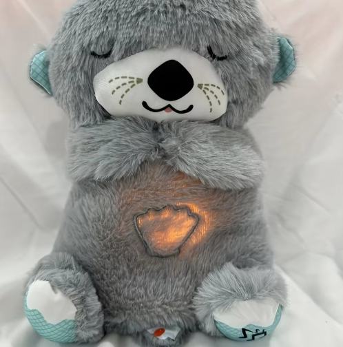Peluche nutria calmante Sleep Buddy gris con luces y música para bebés
